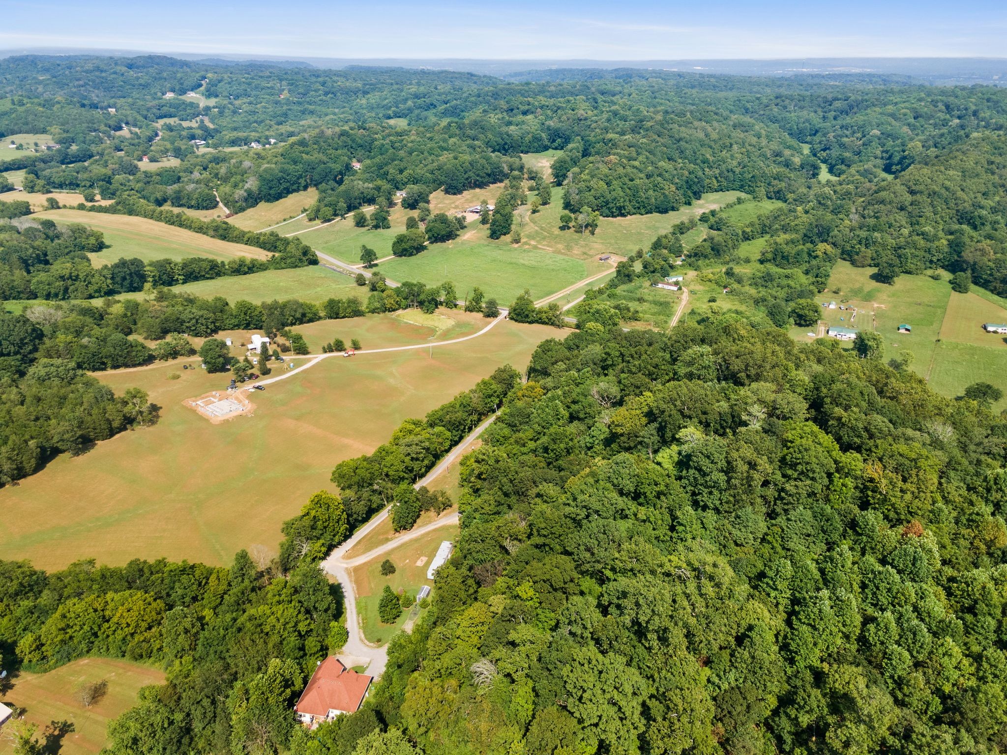 2417 Esque Sharp Road Mount Pleasant, TN 38474 - Photo 1 of 21 an aerial view of residential houses with outdoor space and trees