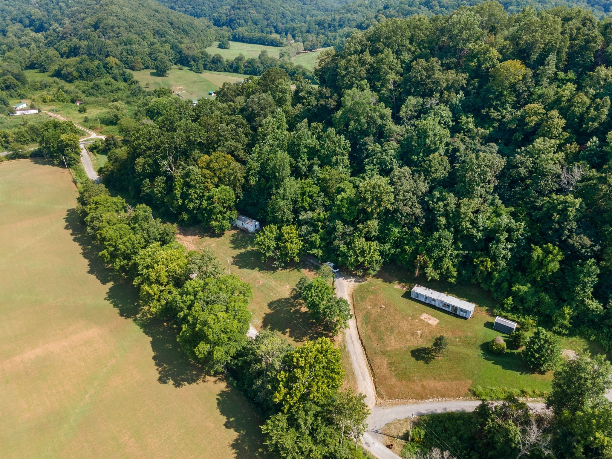2417 Esque Sharp Road Mount Pleasant, TN 38474 - Photo 2 of 21 an aerial view of a house with a yard