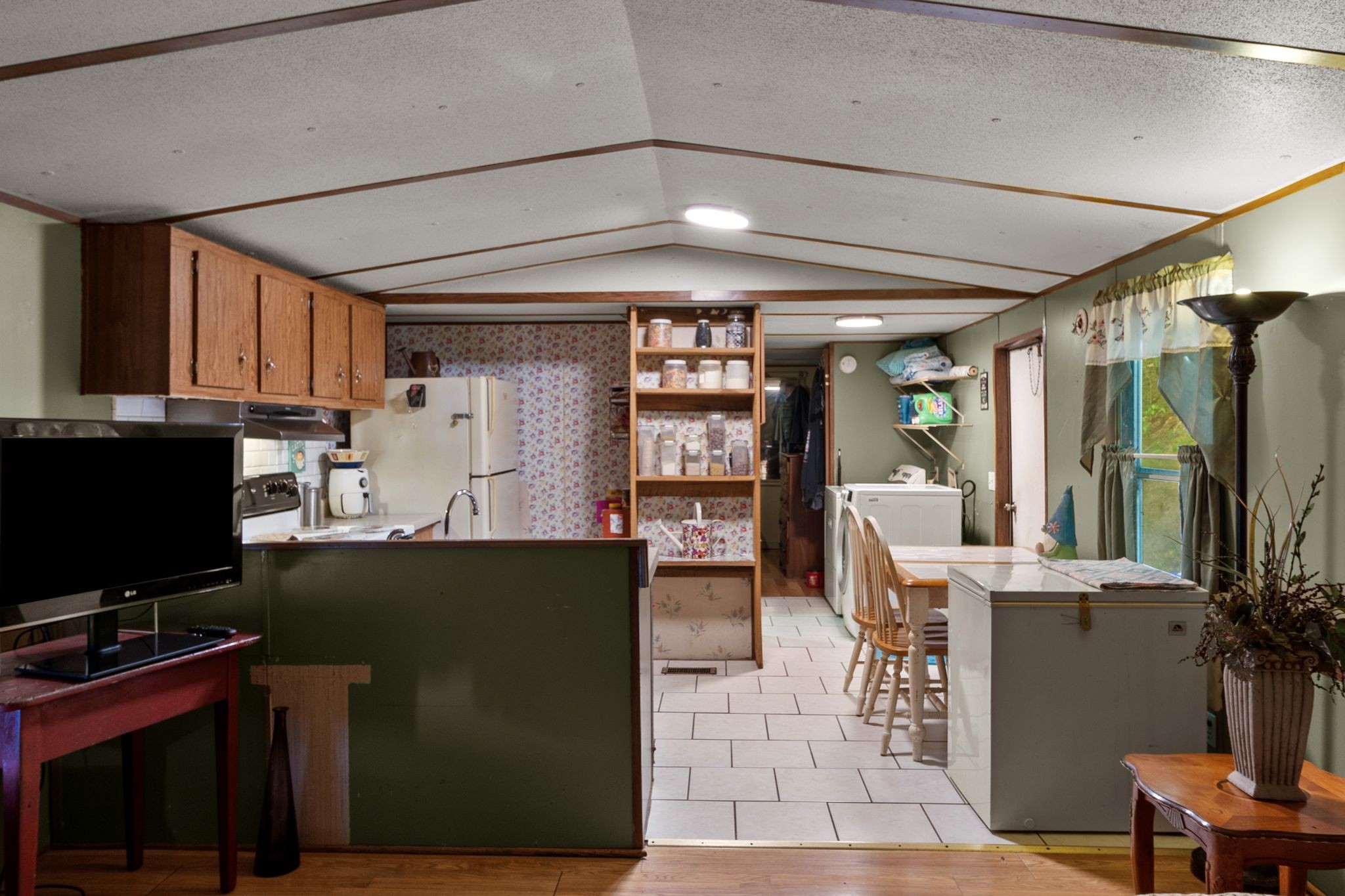 2417 Esque Sharp Road Mount Pleasant, TN 38474 - Photo 7 of 21 a kitchen with refrigerator and cabinets