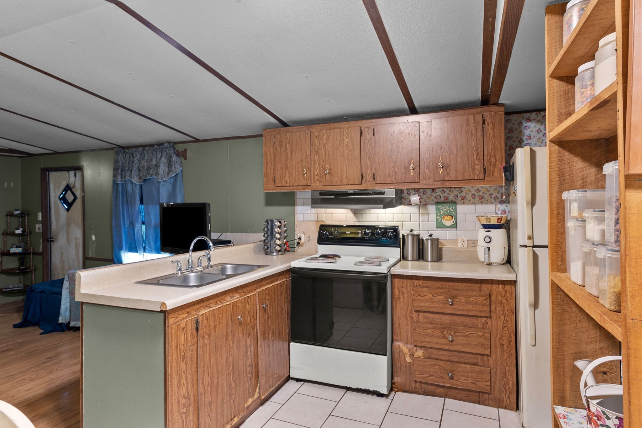 2417 Esque Sharp Road Mount Pleasant, TN 38474 - Photo 8 of 21 a kitchen with a sink stove and cabinets