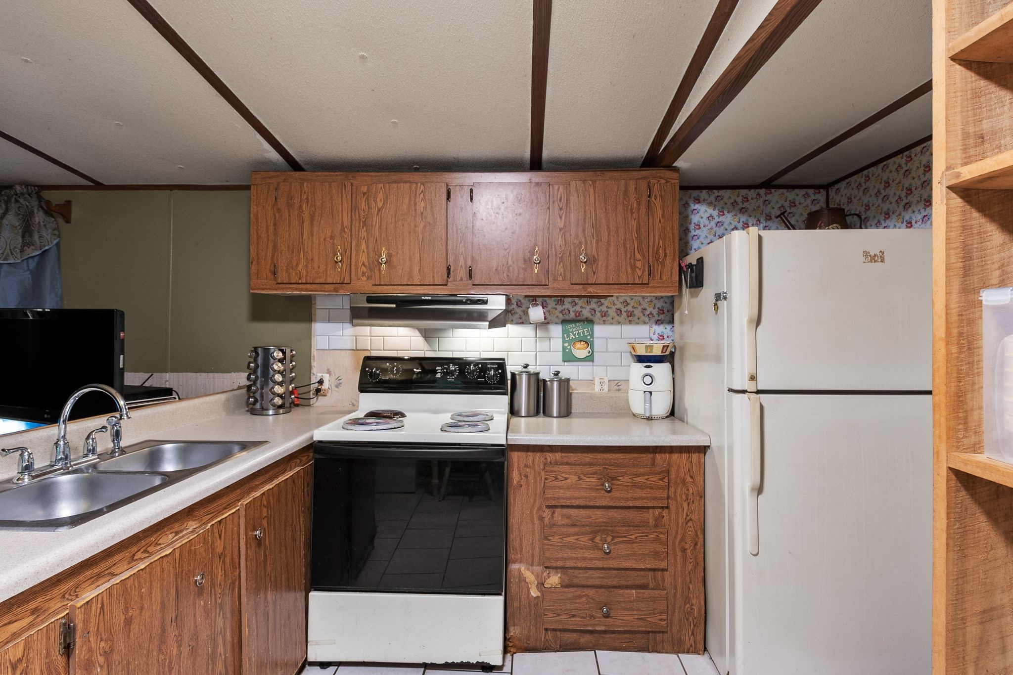 2417 Esque Sharp Road Mount Pleasant, TN 38474 - Photo 10 of 21 a kitchen with stainless steel appliances granite countertop a refrigerator stove a sink dishwasher and a refrigerator