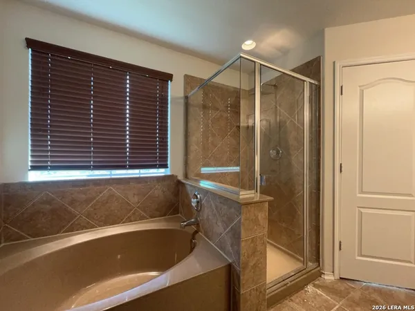 a bathroom with a sink toilet and a mirror