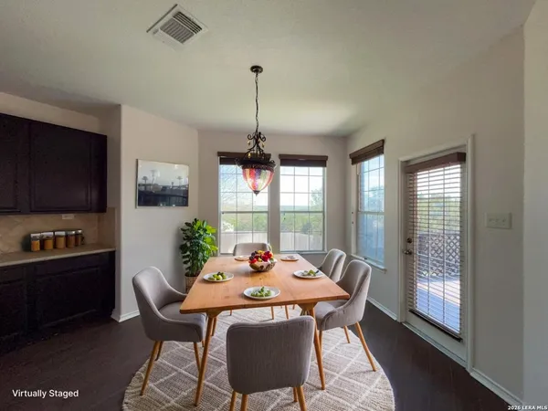 a view of a dining room with furniture window and outside view