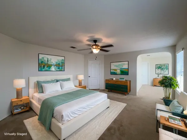 a bedroom with a bed and a couch