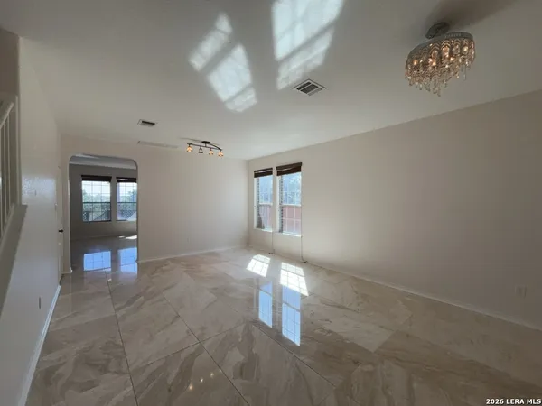 a view of a hallway with a chandelier