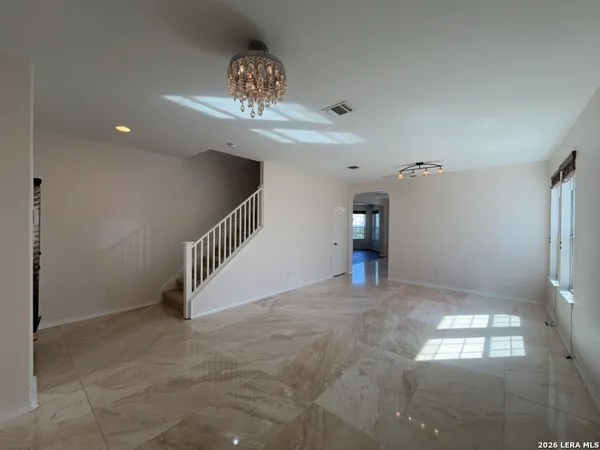 a view of empty room with fireplace