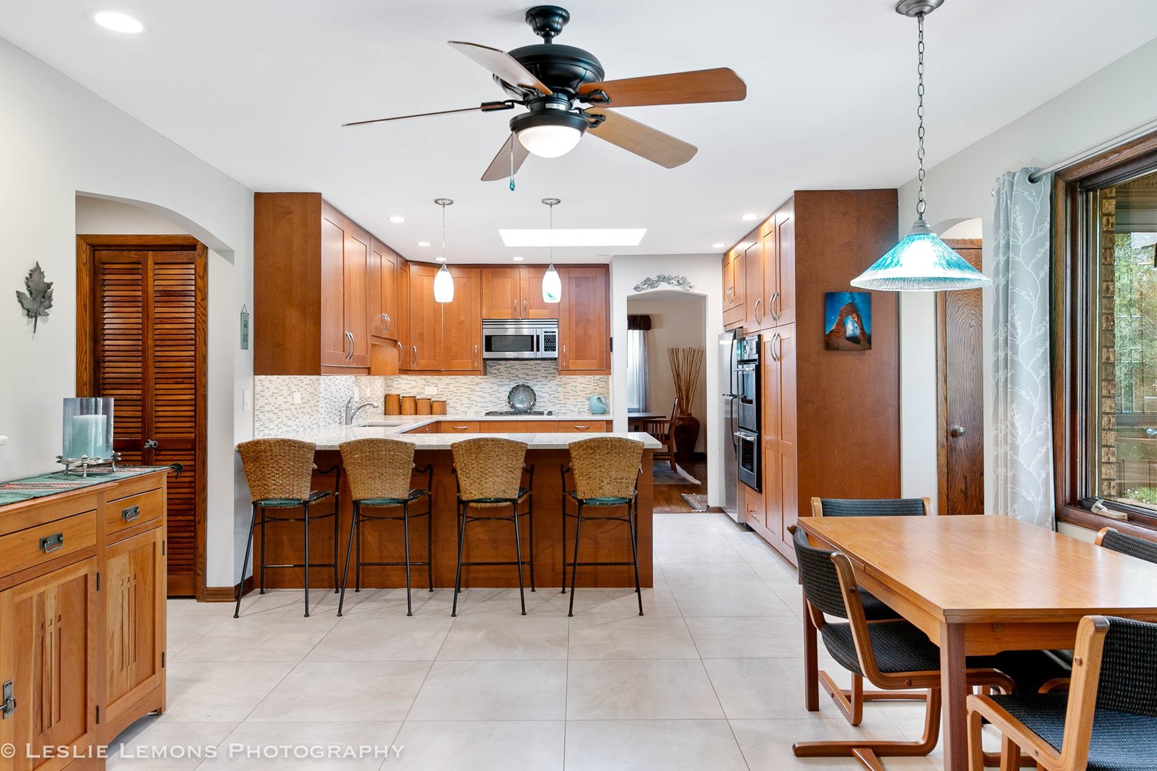 3192 Beller Drive Darien, IL 60561 - Photo 3 of 50 a kitchen with a table chairs refrigerator and cabinets