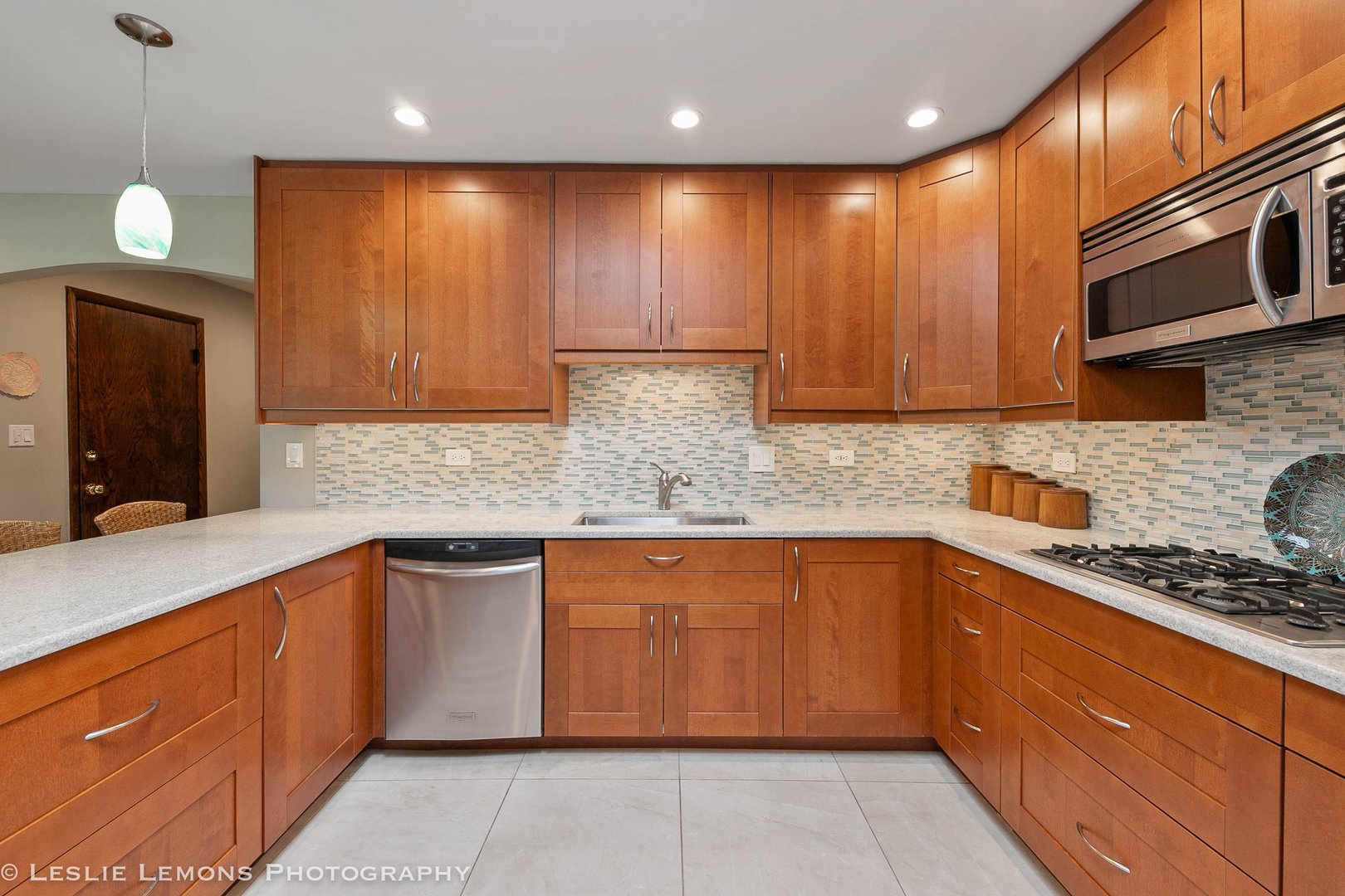 3192 Beller Drive Darien, IL 60561 - Photo 7 of 50 a kitchen with stainless steel appliances granite countertop wooden cabinets a stove top oven a sink and dishwasher