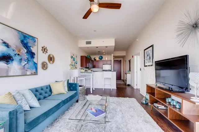 a kitchen with stainless steel appliances a stove a sink dishwasher and a refrigerator