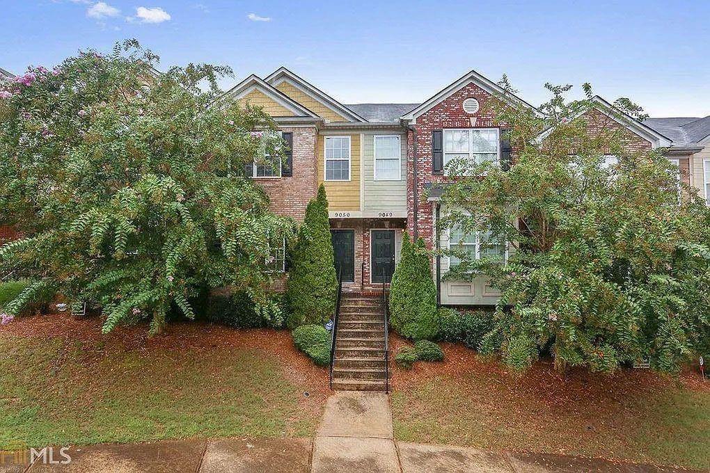 8045 Bayrose Circle, Unit 45A East Point, GA 30344 - Photo 1 of 1 a front view of a house with a garden