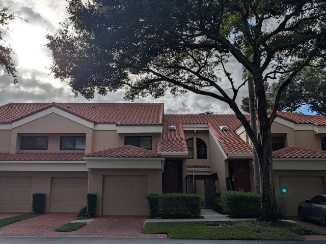 a front view of a house with yard