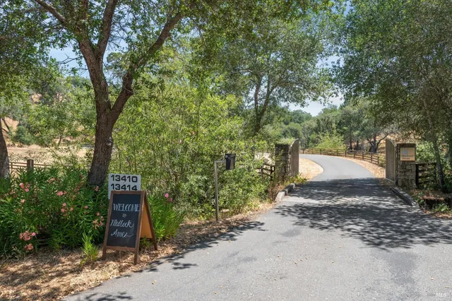 a room with a table chairs and a wooden floor