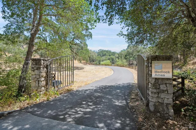 a bathroom with a double vanity sink mirror and shower
