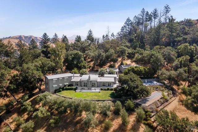 a bedroom with a bed and a table