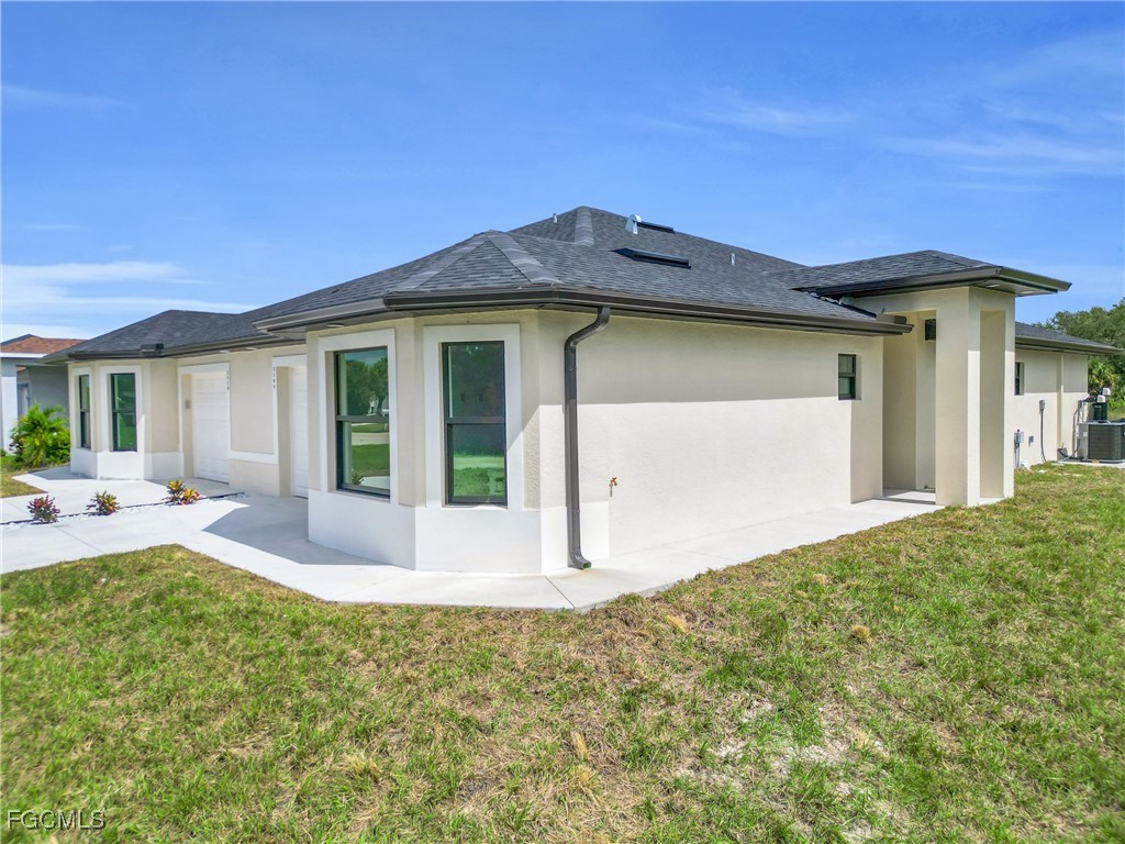 2508-2510 Park Road Lehigh Acres, FL 33971 - Photo 36 of 37 a view of a house with backyard and porch
