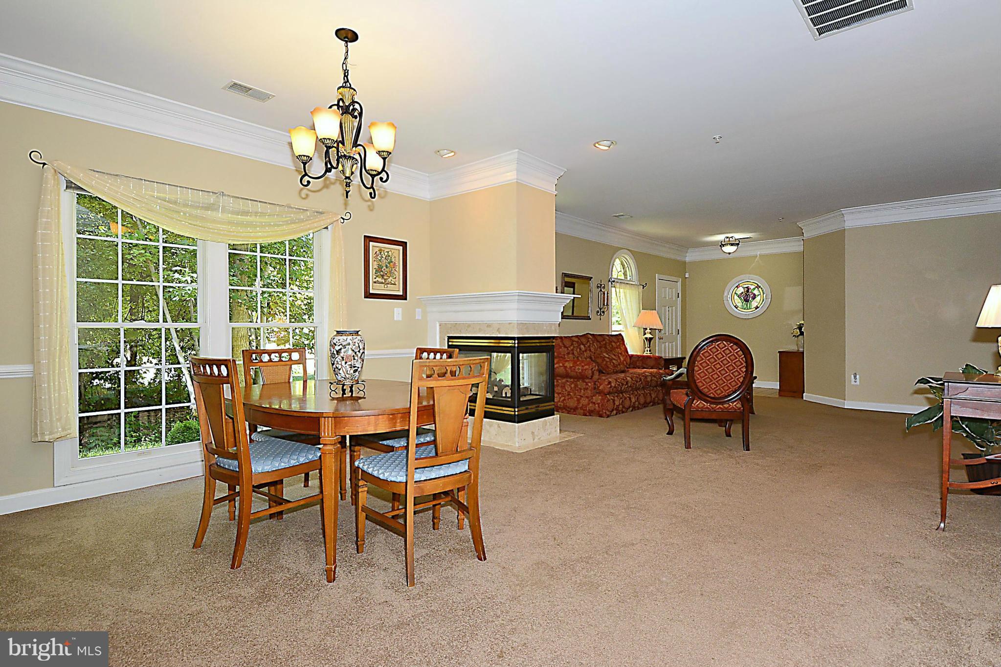 383 Colony Point Place Edgewater, MD 21037 - Photo 8 of 30 Enjoy the Fireplace from both Dining