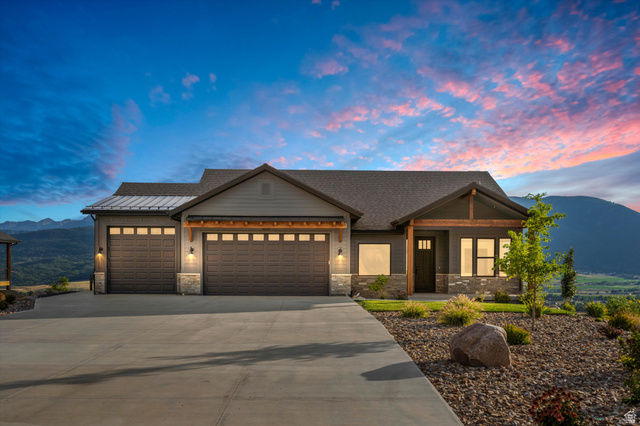 4499 North Seven Bridges Road, Unit 9 Eden, UT 84310 - Photo 1 of 65 Exterior featuring stone accents, horizontal siding, and a shingled roof