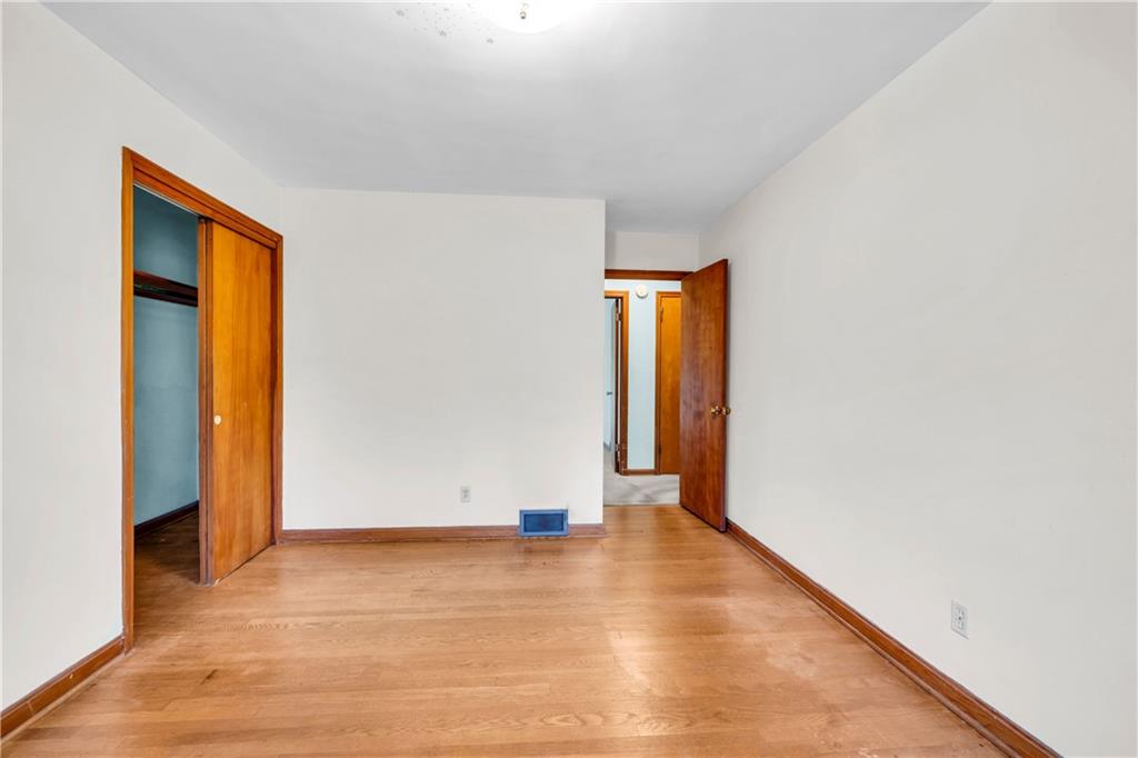 2425 Melinda Court Northeast Atlanta, GA 30345 - Photo 14 of 22 a view of an empty room with wooden floor and closet