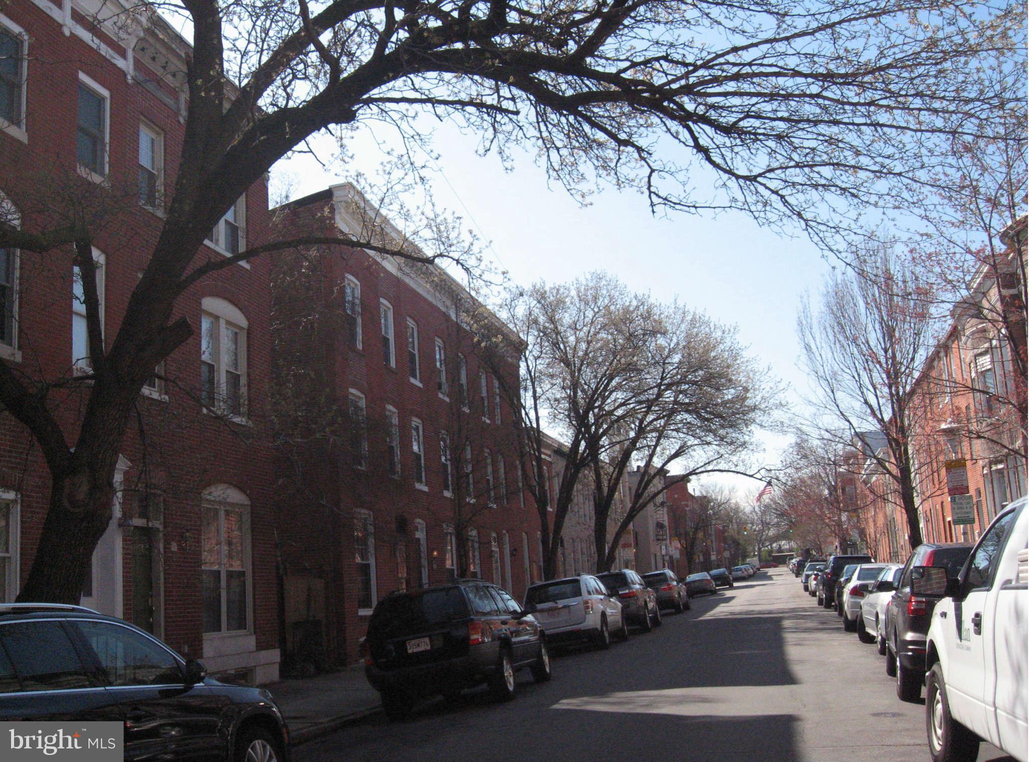 1415 Riverside Avenue Baltimore, MD 21230 - Photo 19 of 24 a view of a city street with a car parked on the road