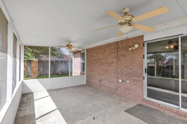 a view of a house with yard and sitting area