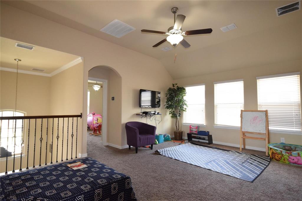12421 Hitch Rack Way McKinney, TX 75071 - Photo 15 of 21 a bedroom with furniture and a window