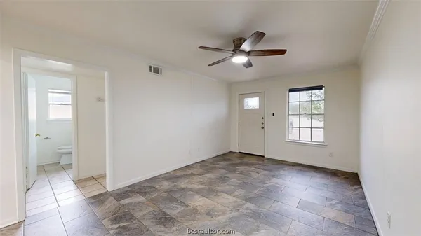 a view of an empty room with a window