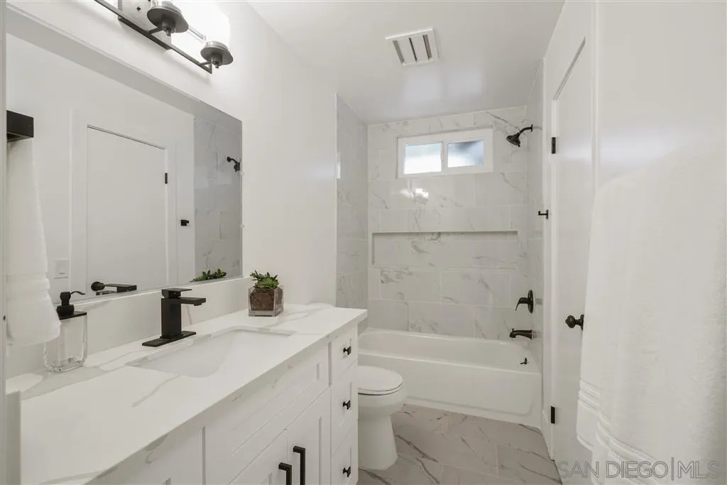 751 Crestview Road Vista, CA 92081 - Photo 18 of 24 a bathroom with a sink a toilet and shower