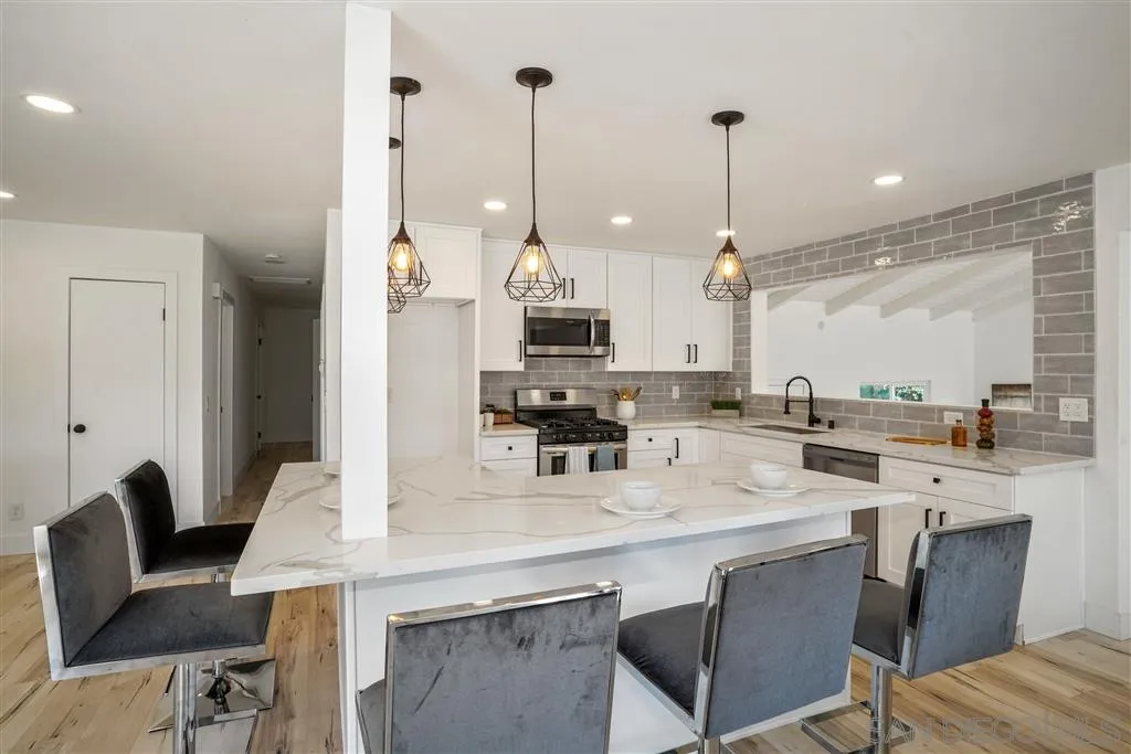 751 Crestview Road Vista, CA 92081 - Photo 3 of 24 a view of kitchen and dining area with furniture