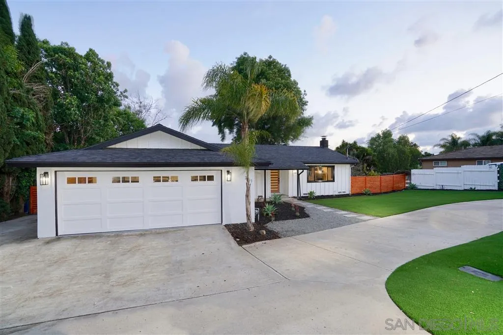 751 Crestview Road Vista, CA 92081 - Photo 5 of 24 a front view of a house with a yard and garage