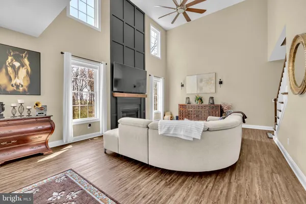 a kitchen with stainless steel appliances granite countertop a stove a sink and a white cabinets