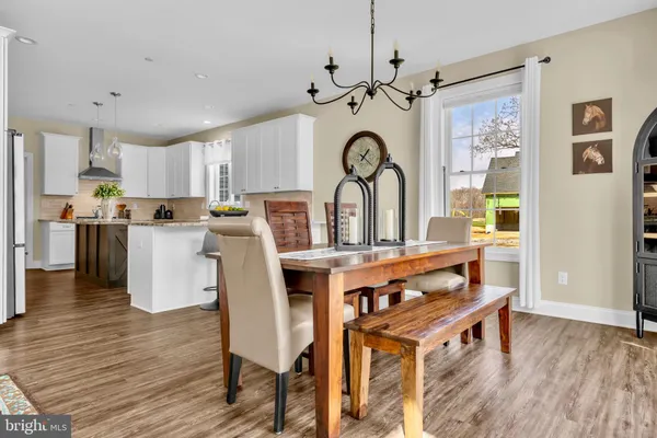 a kitchen with stainless steel appliances granite countertop a refrigerator sink and cabinets