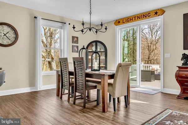 a large white kitchen with cabinets
