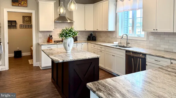 a bathroom with a sink toilet and a mirror