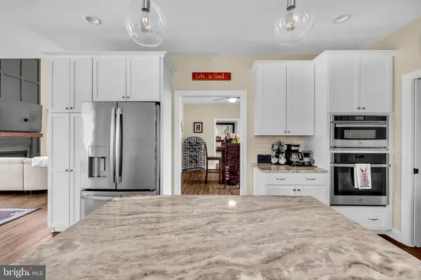 a view of a room with wooden floor and stairs