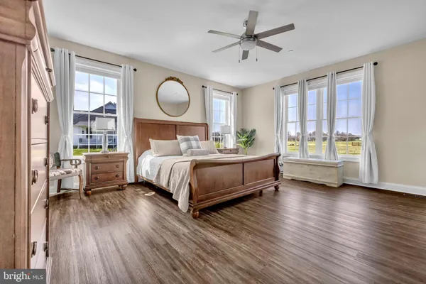 a bedroom with a bed and a chair