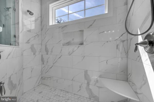 a living room with furniture a flat screen tv and a table