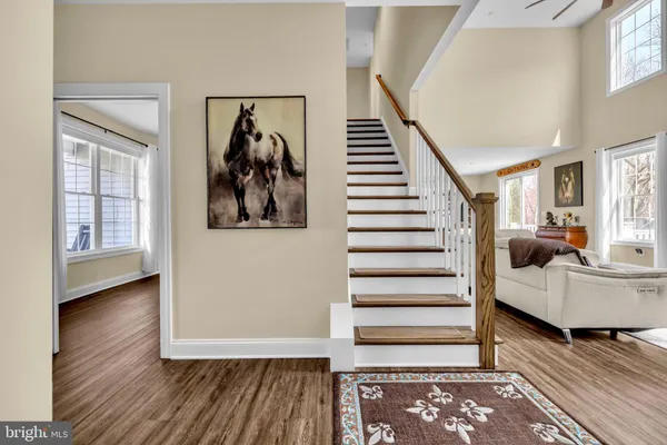 a view of a balcony with furniture and floor to ceiling window