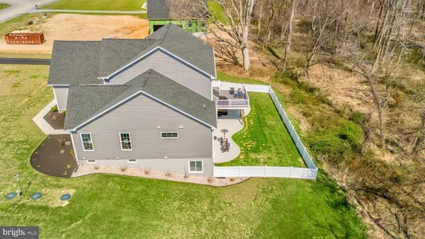 a front view of a building with a yard