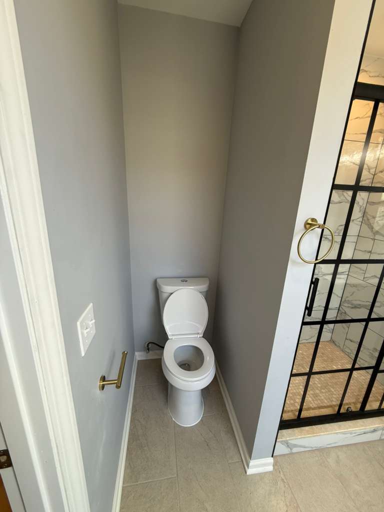 448 North Aberdeen Street, Unit 3 Chicago, IL 60642 - Photo 11 of 15 a white toilet sitting next to a small sink
