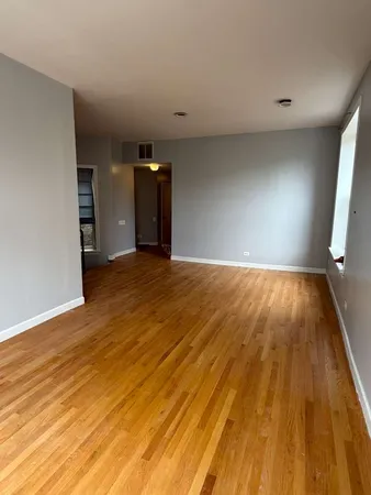 a view of a big room with wooden floor