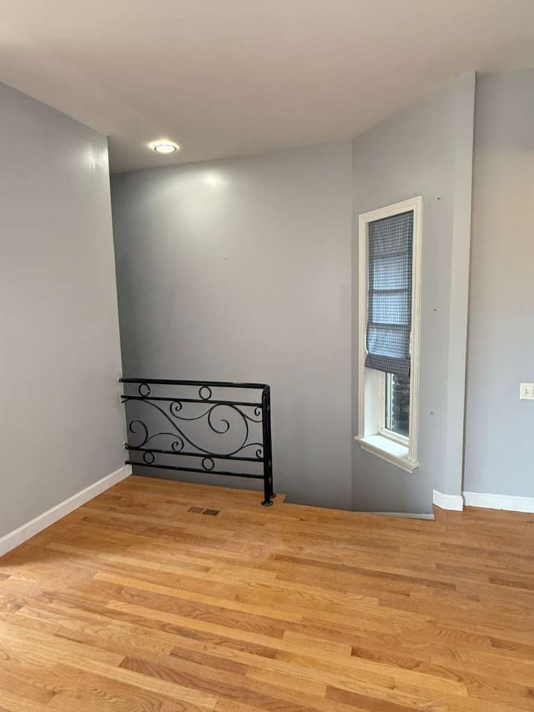 448 North Aberdeen Street, Unit 3 Chicago, IL 60642 - Photo 5 of 15 a view of empty room with wooden floor
