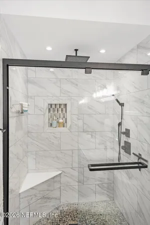 a bathroom with a sink and mirror