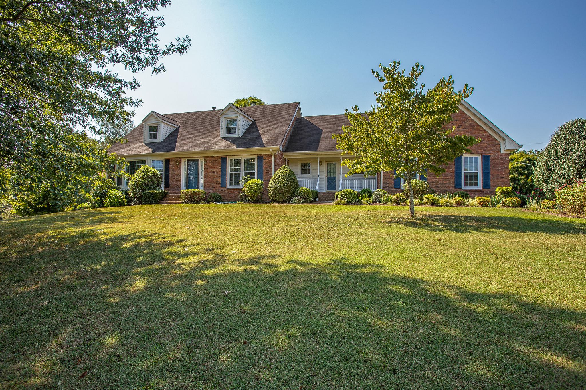 a view of a house with a big yard