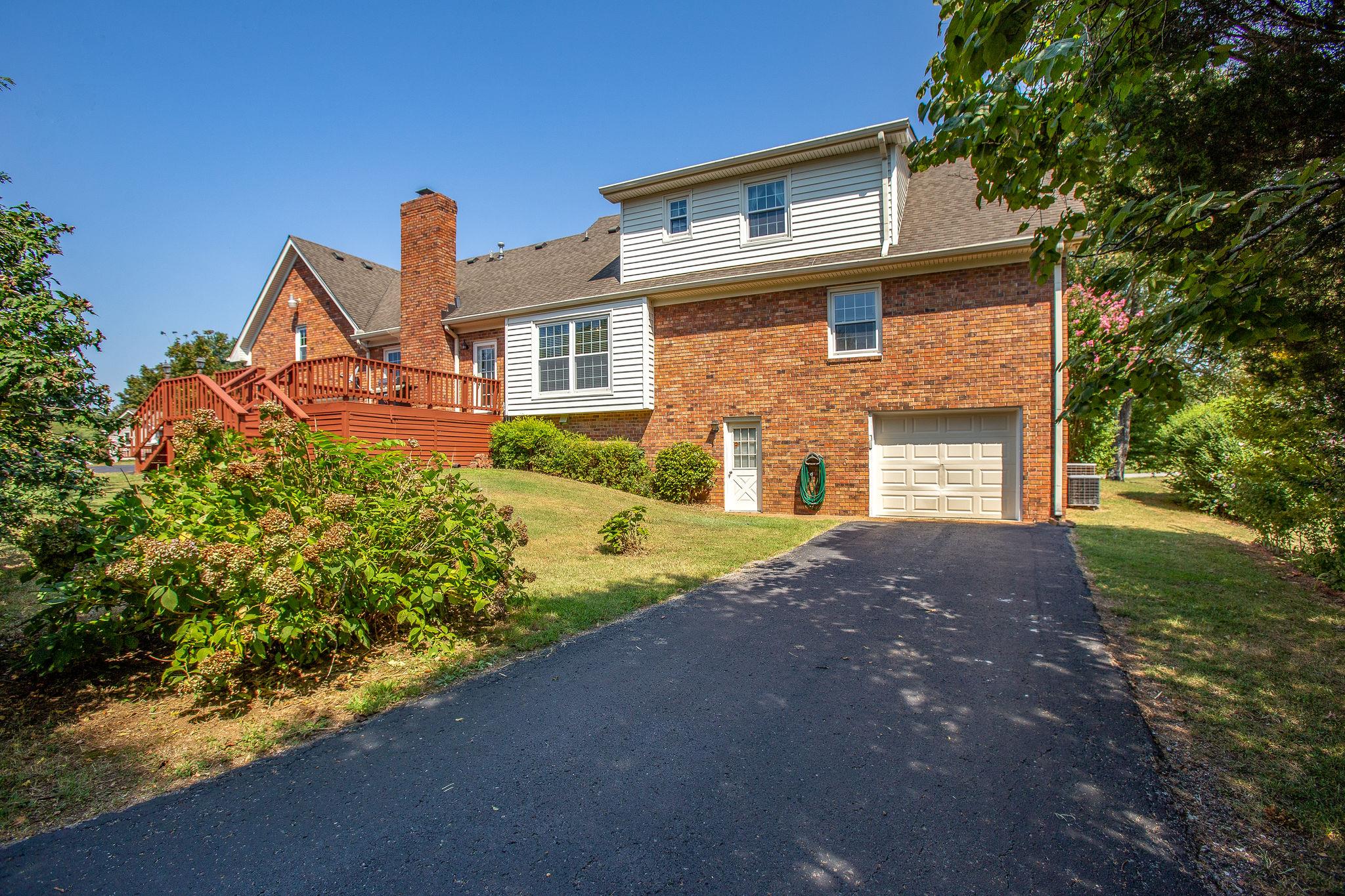 4047 Arno Road Franklin, TN 37064 - Photo 27 of 30 a front view of a house with a yard and garage