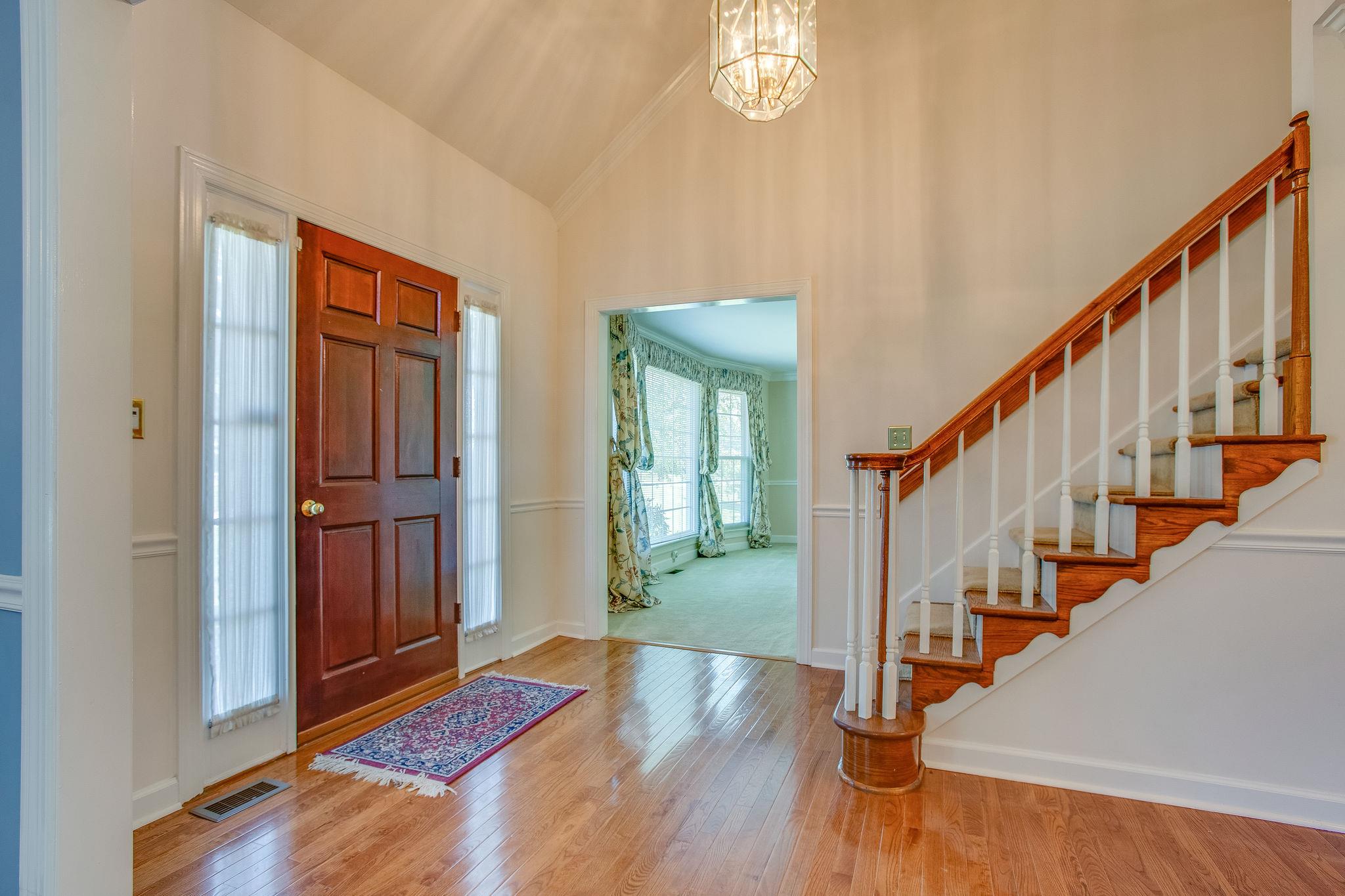 4047 Arno Road Franklin, TN 37064 - Photo 6 of 30 a view of an entryway with wooden floor and stairs