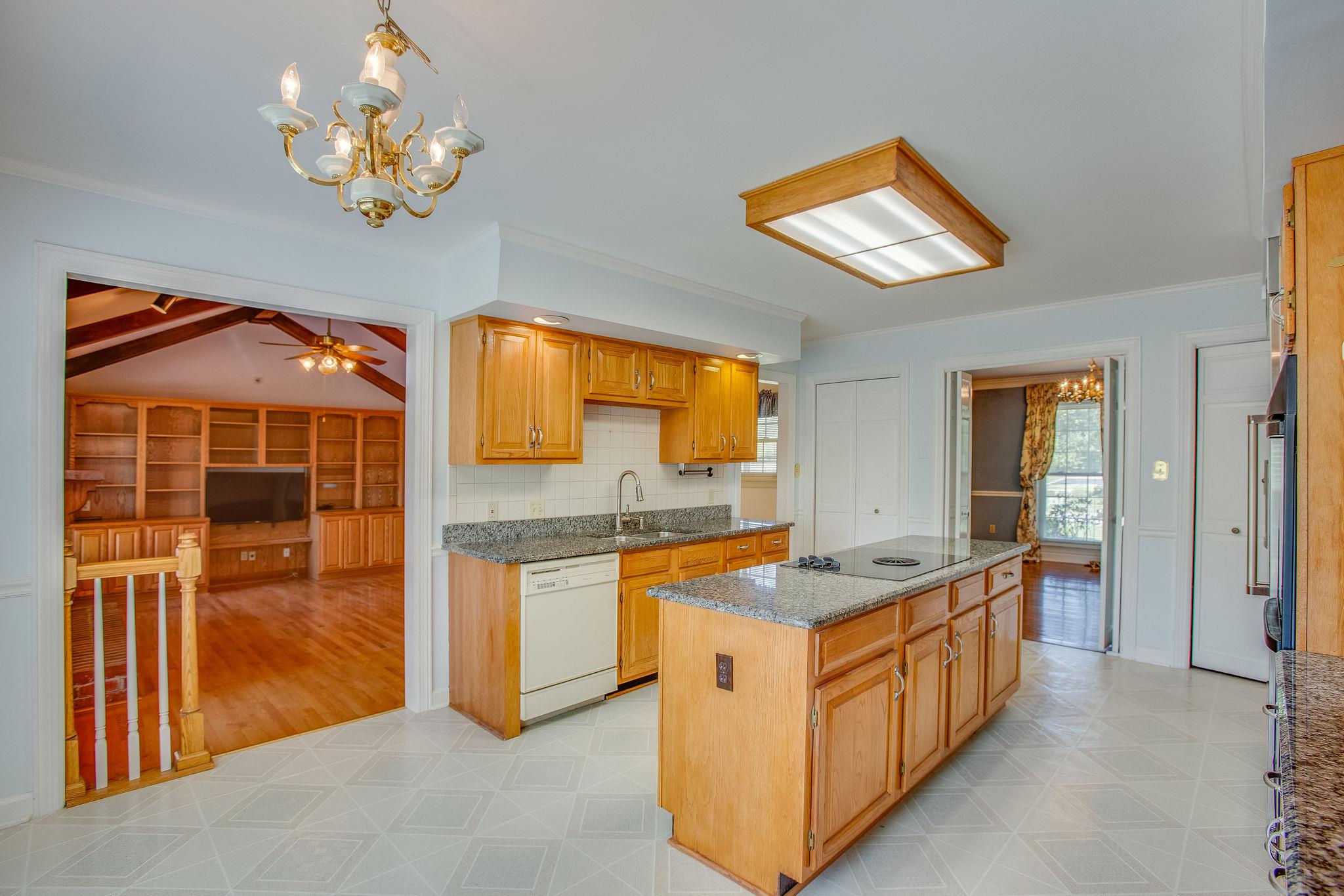 4047 Arno Road Franklin, TN 37064 - Photo 10 of 30 a kitchen with stainless steel appliances granite countertop a stove and a sink