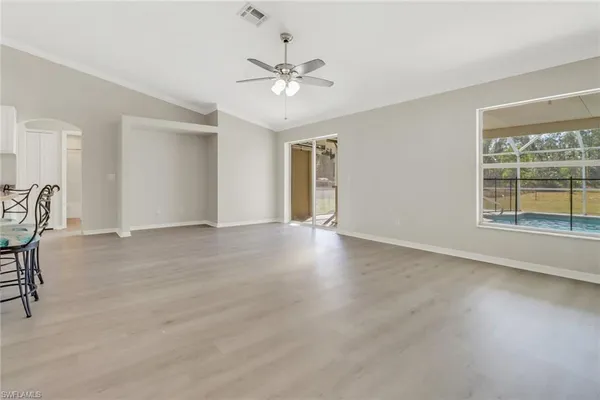 a view of a livingroom with a ceiling fan and window
