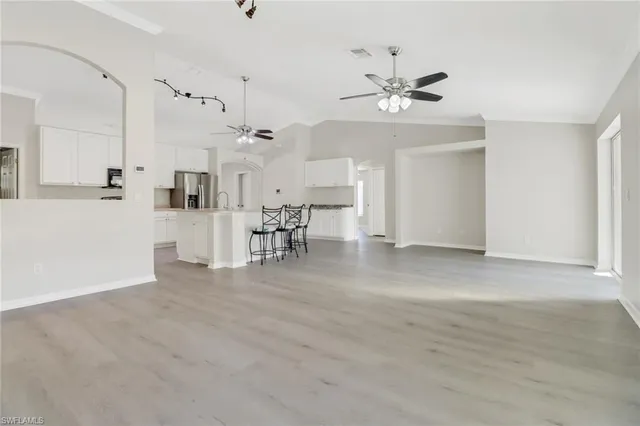 a view of a livingroom with a kitchen
