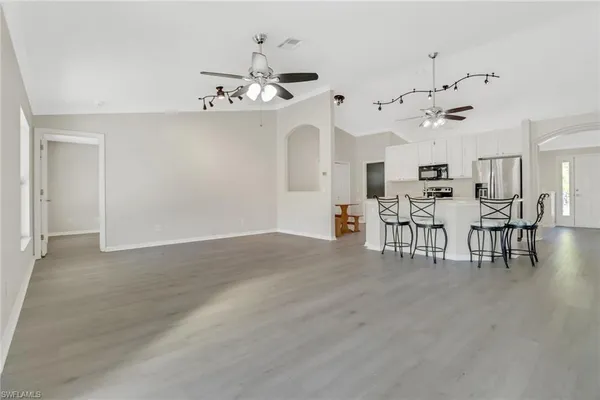 an open kitchen with a table and chairs