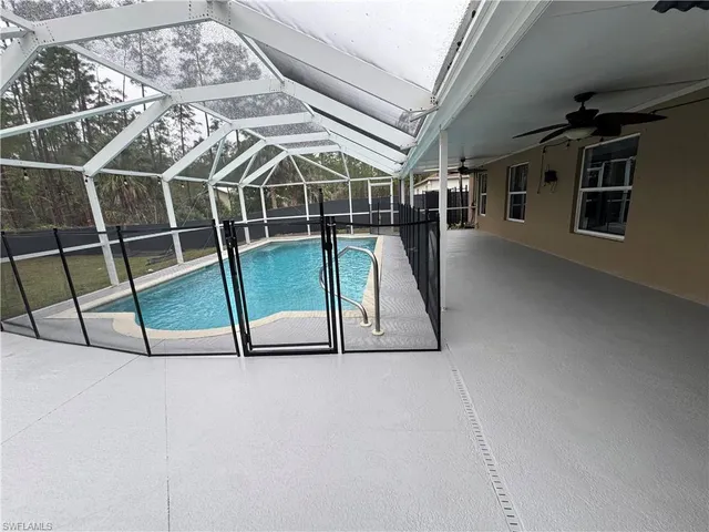 a view of an empty room with windows